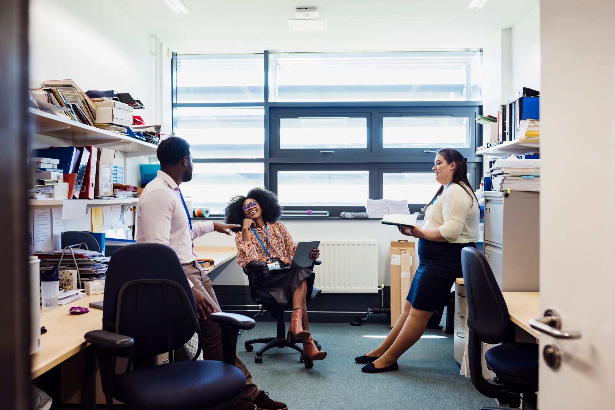 Writers and editors discussing ideas in an office