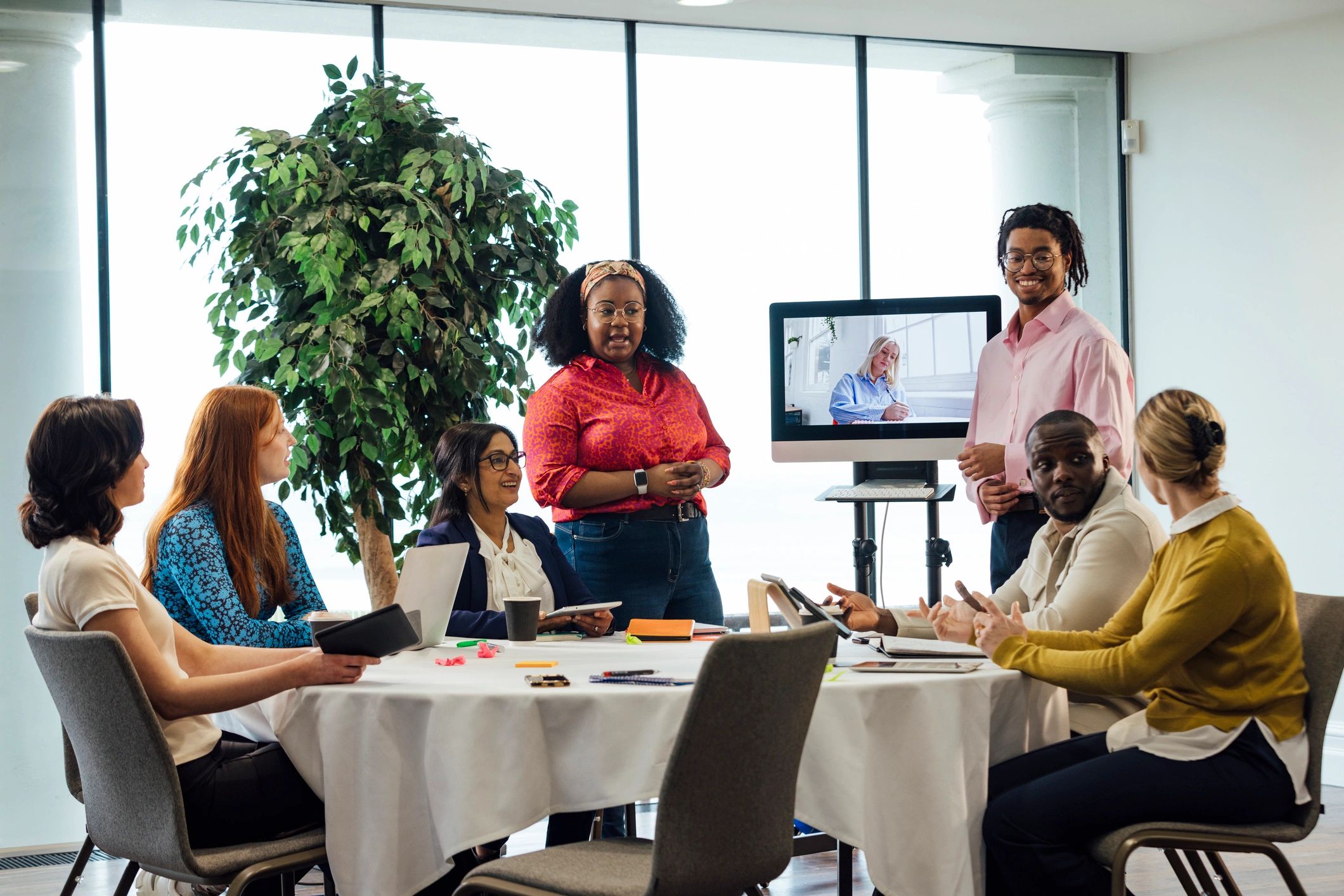 Editorial meeting in a modern newsroom setting