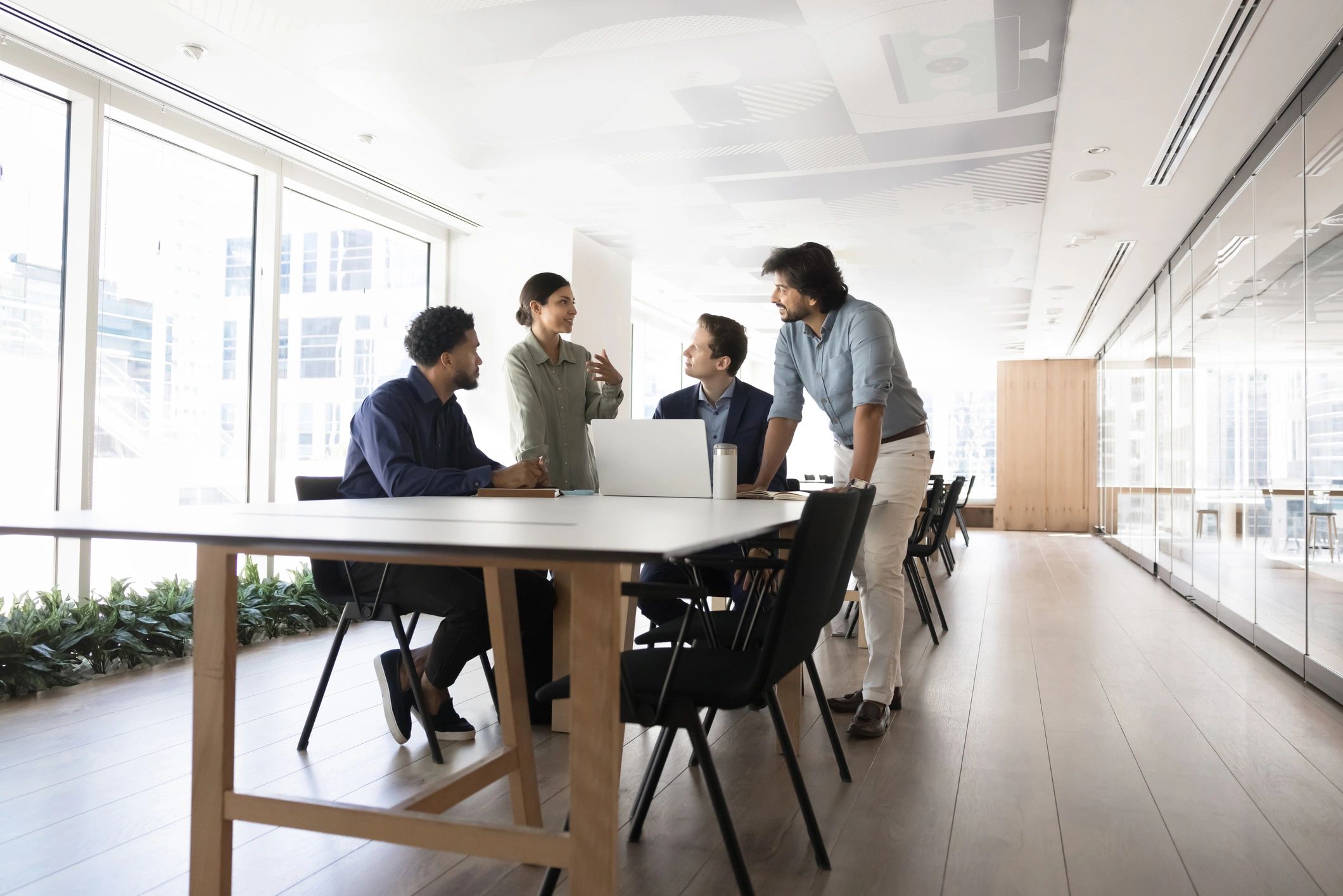 Journalists and editors collaborating around a meeting table